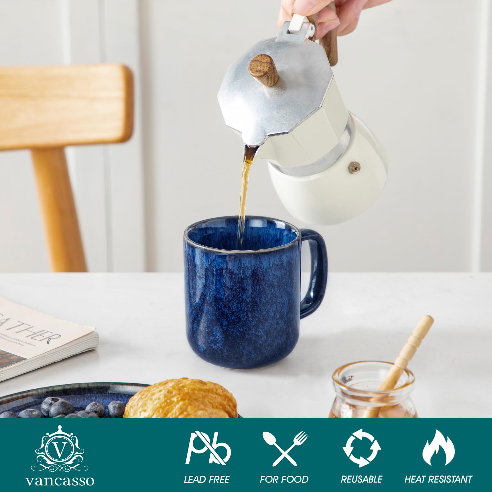 Vancasso STARRY blue 12oz mug held in hand for warmth