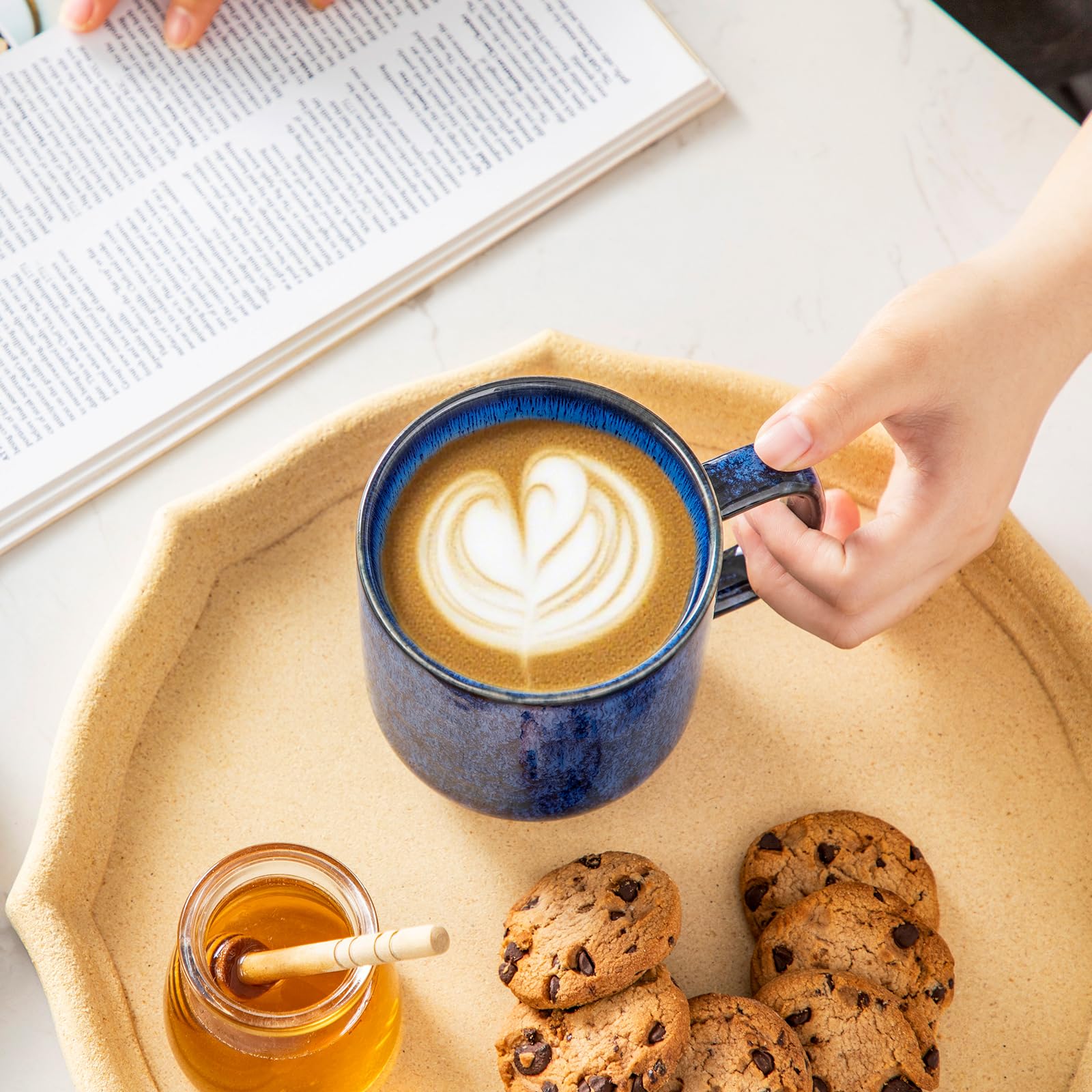 Vancasso STARRY blue mugs shown on table, perfect for tea.