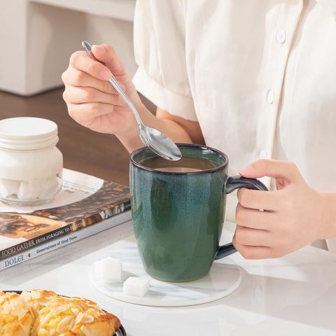 Minimalist glossy green finish from Vancasso Starry enhances table presentation.