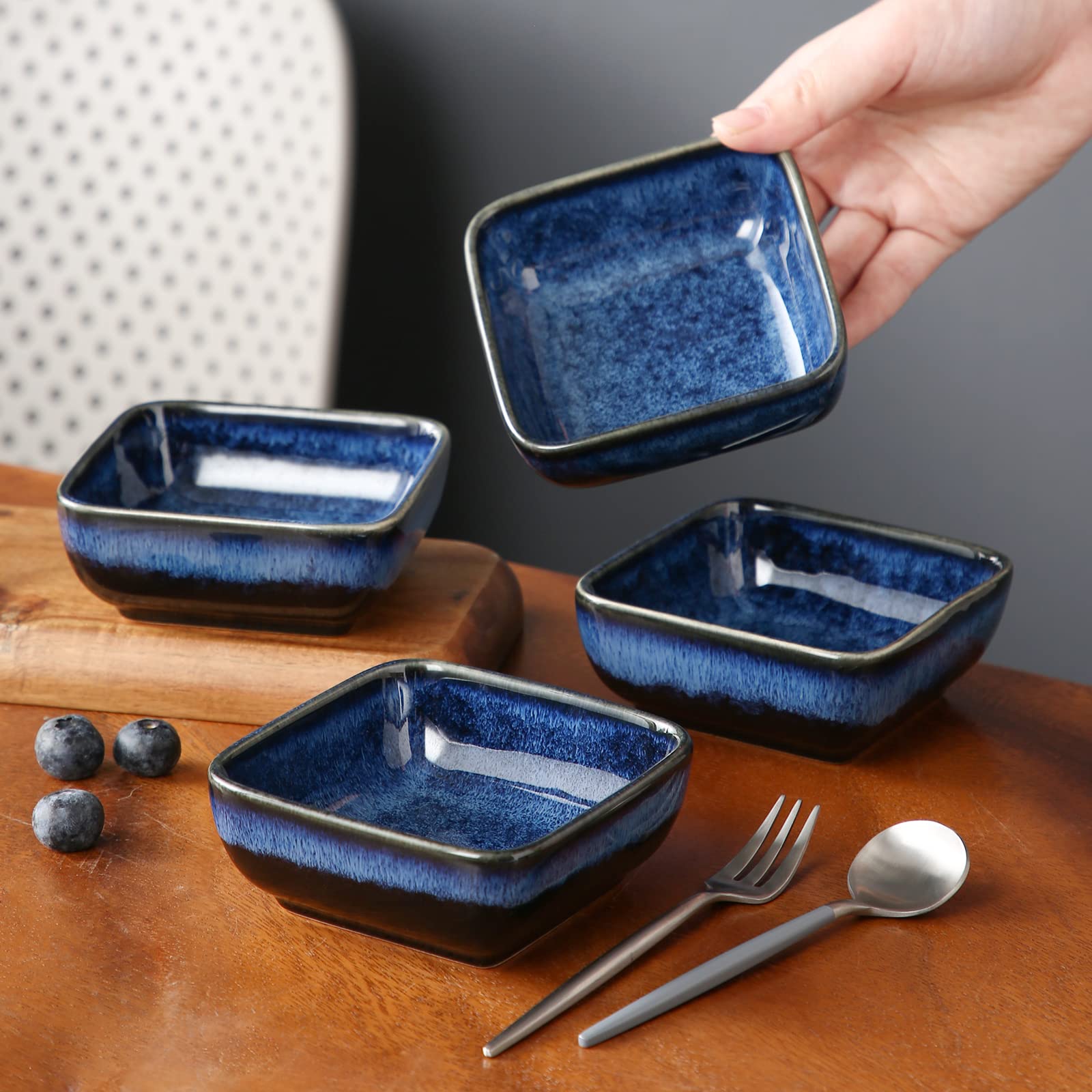 Vancasso Stern 4-piece set enhances table presentation with a night-sky glaze.