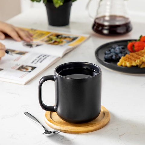Vancasso mug with hot coffee demonstrates comfortable grip.