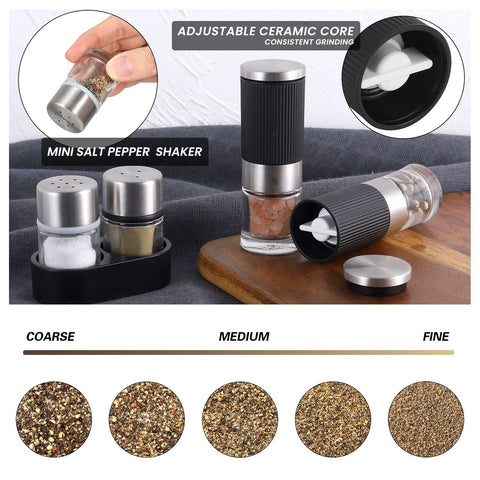 Two mini shakers beside salt and pepper particles.