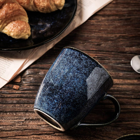 Vicrays porcelain mug with wide handle for comfortable tea or coffee.