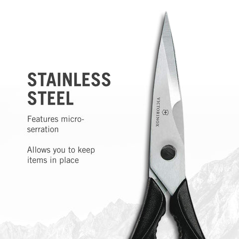 Victorinox Swiss Classic Come Apart Kitchen Shear with micro-serrated blades gripping herbs and vegetables for precise cuts.