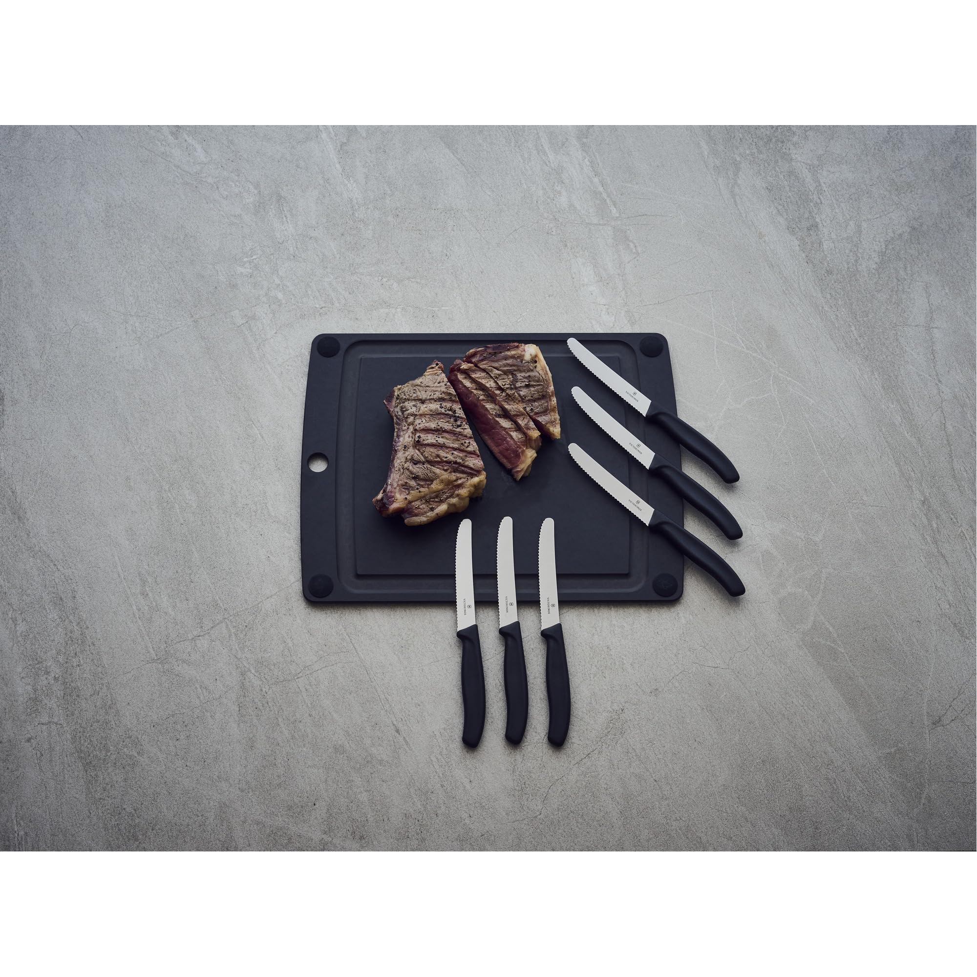 Ergonomic textured handle of Victorinox knife set supports comfortable grip.