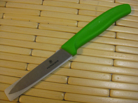 Victorinox paring knife ergonomic handle provides secure grip even when wet for control.