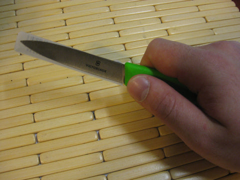 Victorinox Swiss Classic paring knife shown for garnishing and peeling delicate prep.