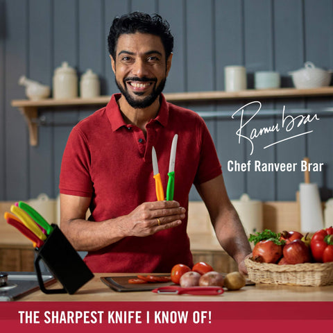 Victorinox Swiss Classic paring knife with red handle, perfect for small fruit and vegetable prep.