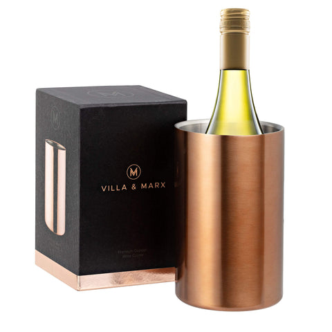 Villa & Marx wine chiller copper bucket on counter keeps bottle cool stylishly.