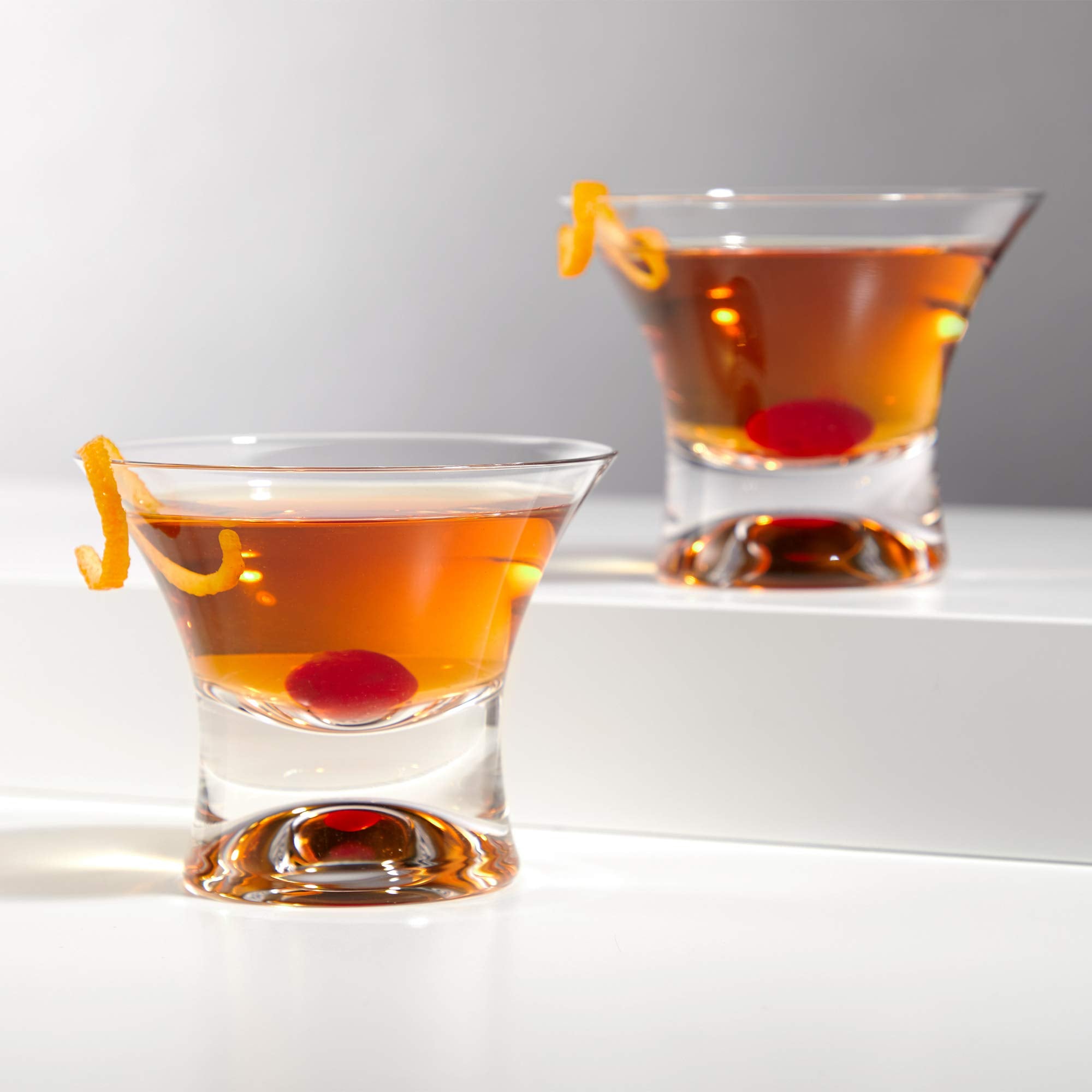 Viski Manhattan glass on a bar cart for stylish entertaining.