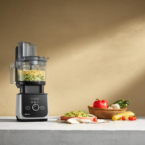 Vitamix 12-Cup work bowl ready for chopping and mixing tasks.