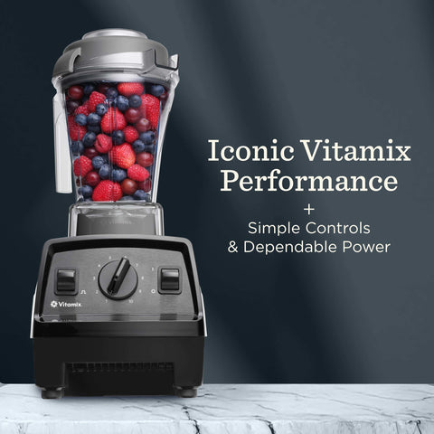 Vitamix Explorian E310 stainless-steel blades powering through fibrous produce.