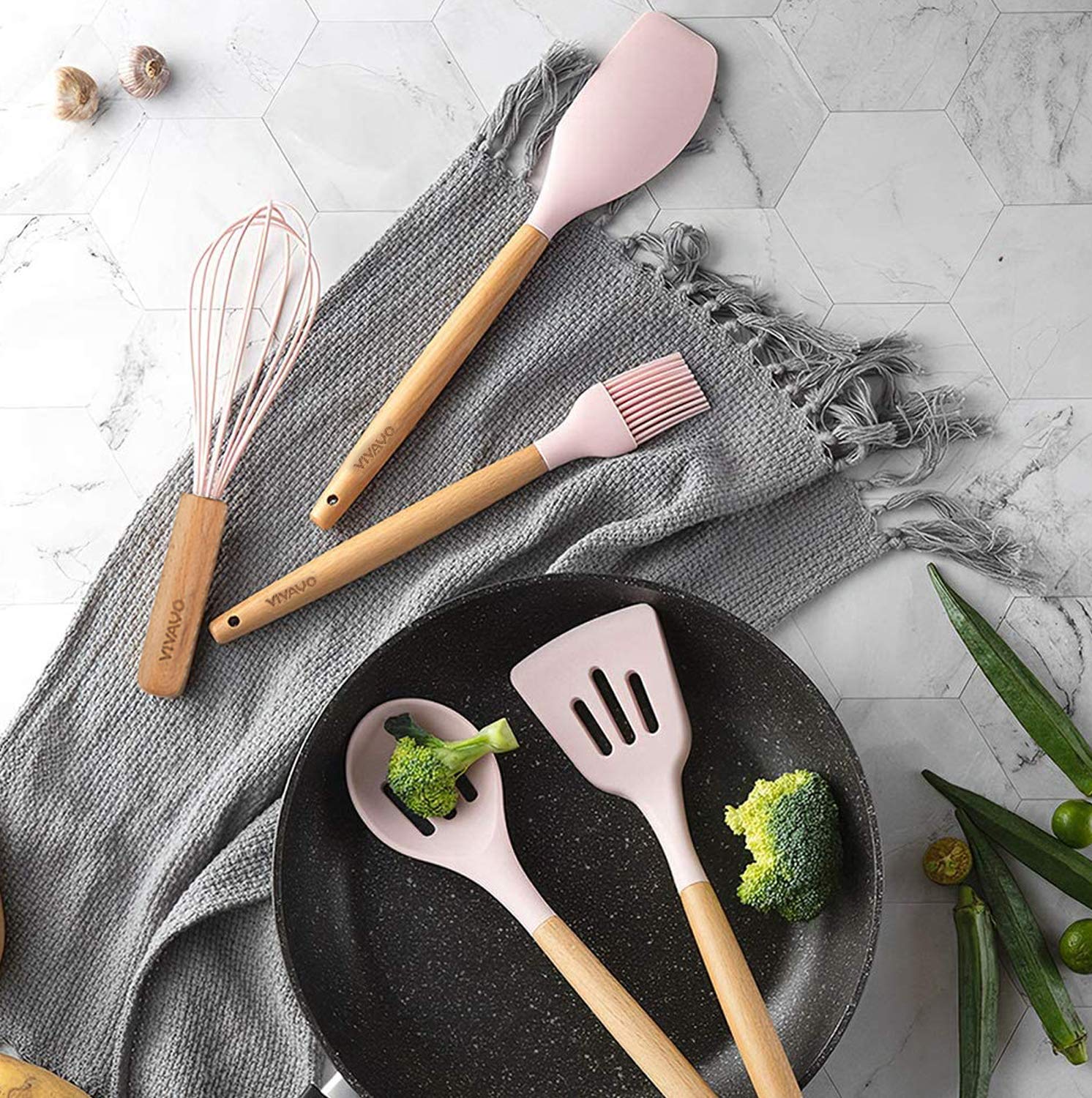 VIVAYO silicone tongs with heat-resistant grip for serving hot dishes.