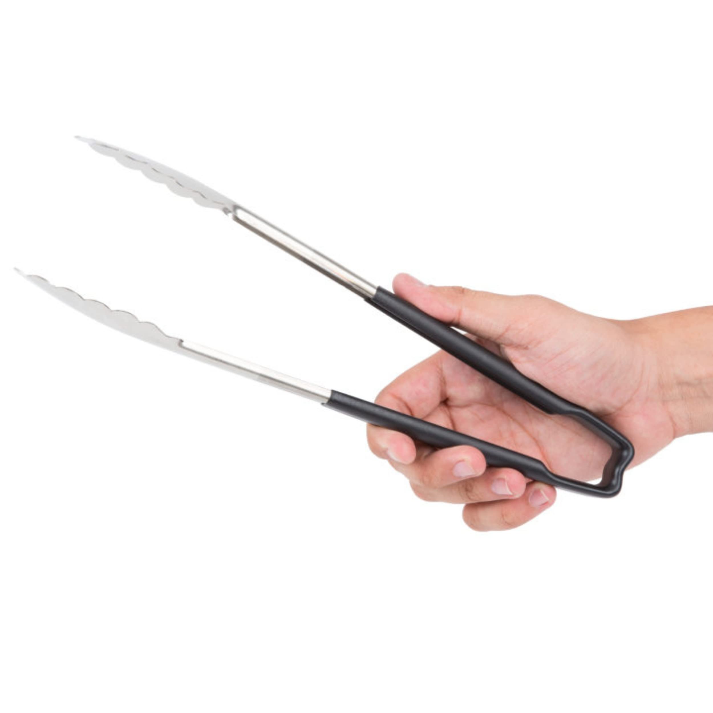Vollrath pasta tongs in use for sautéed noodles and vegetables