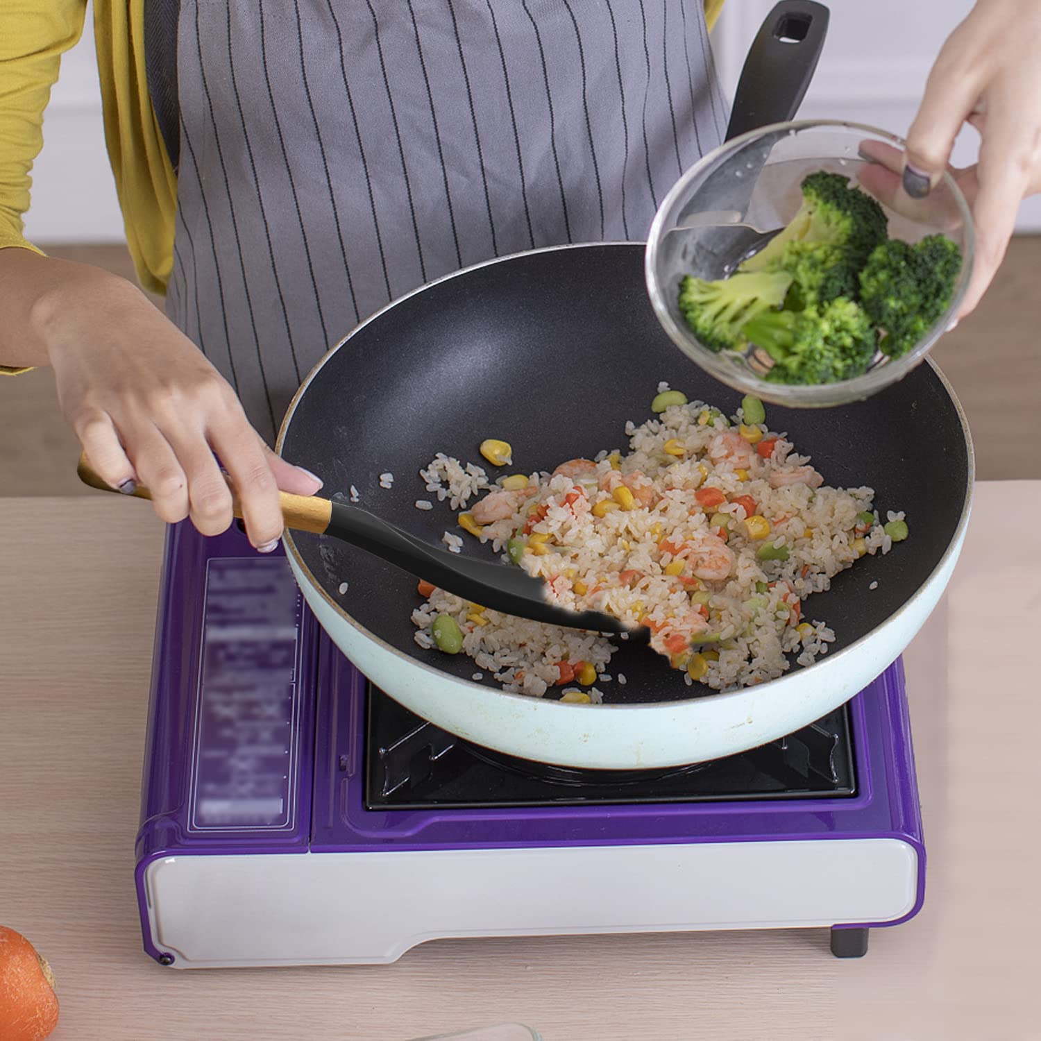 Vovoly ergonomic handle spoon provides comfortable grip during cooking.