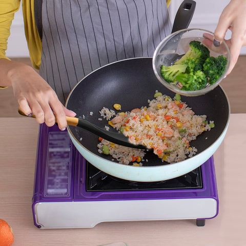 Vovoly ergonomic handle spoon provides comfortable grip during cooking.