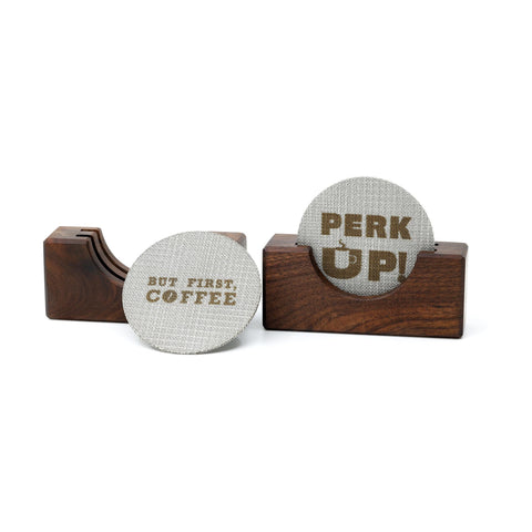 Walnut Coffee puck screen in use atop an espresso shot for improved flow.
