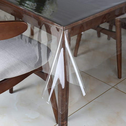 Walrus clear vinyl tablecloth protector on a dining table for spill protection.