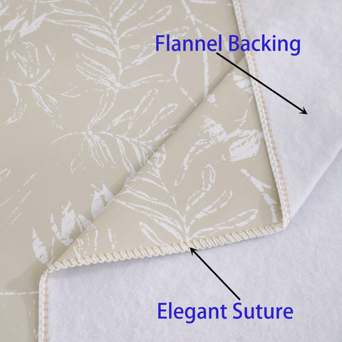 Walrus flannel-backed beige leaf tablecloth adds warm, classic ambiance.