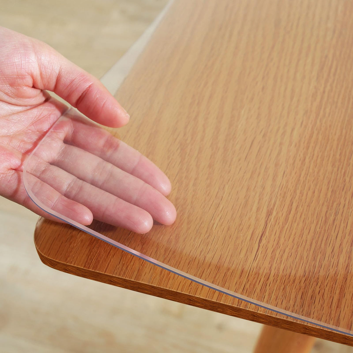 Warmstar clear table cover preserves natural wood look while protecting surfaces from spills.