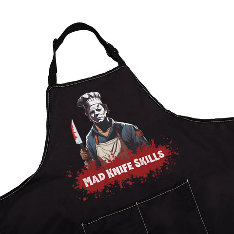 WCGXKO Horror Michael apron pockets showcase convenient storage for utensils and tools.