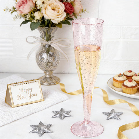 WDF pink glitter champagne flutes with ergonomic design for comfortable sipping.