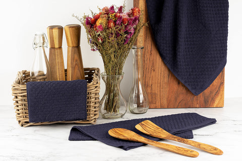 Wealuxe navy towel stack demonstrates generous size for versatile kitchen tasks.