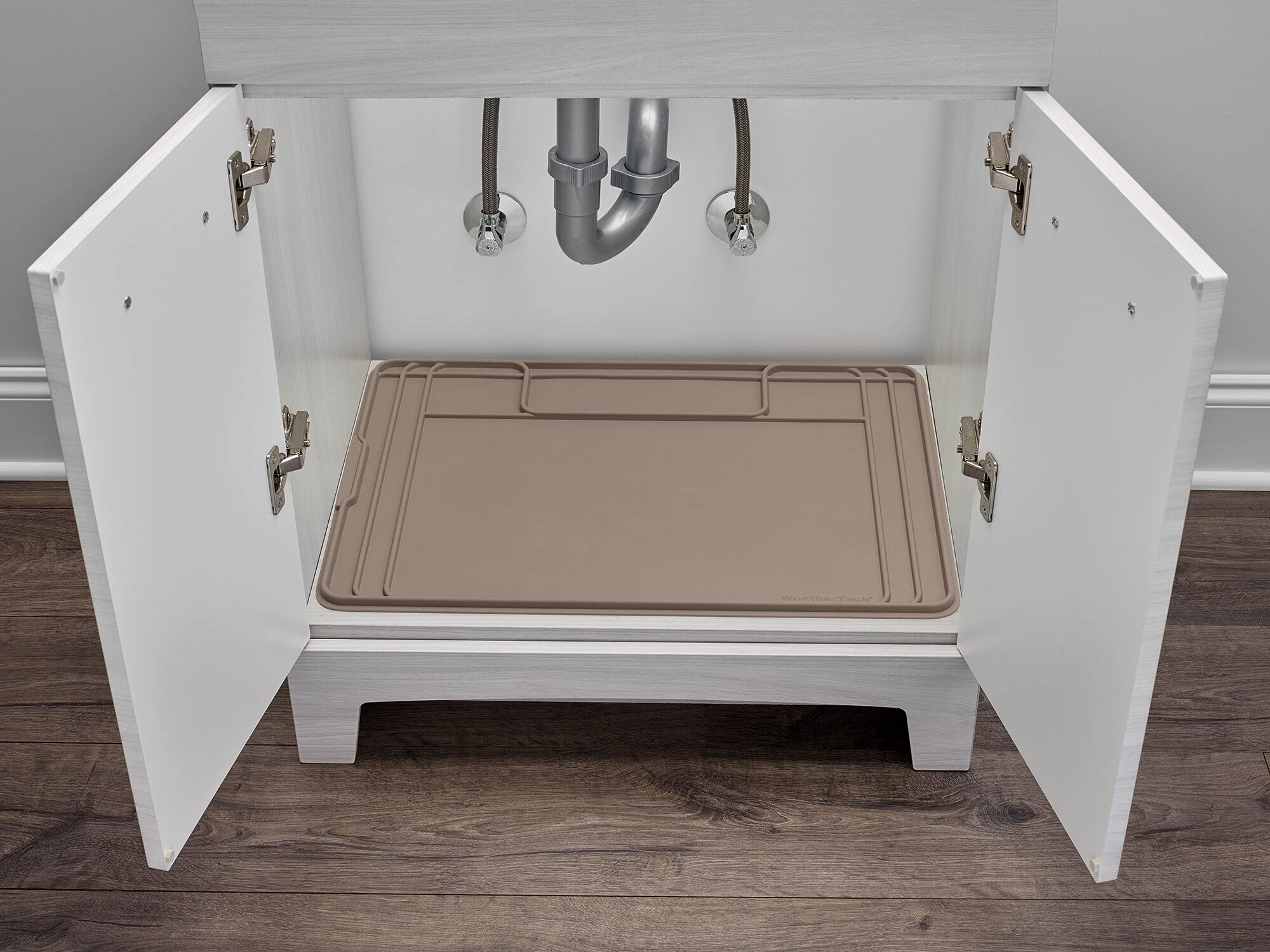 WeatherTech SinkMat with raised lip traps leaks for dry cabinet floors.