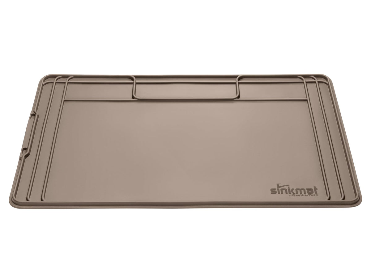 WeatherTech SinkMat under-sink liner in tan protects cabinets from spills.