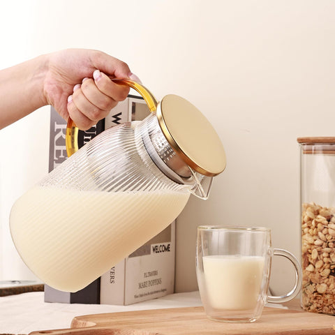 Wells ribbed glass pitcher on table, stylish serveware for lemonade and juice