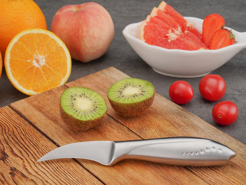 WELLSTAR fruit and vegetable peeling and garnishing tool for intricate prep.