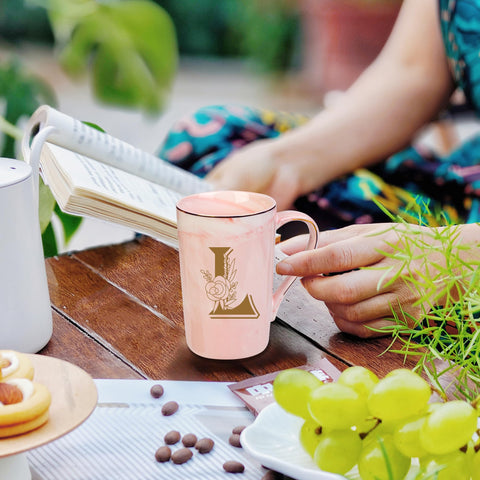 WENSSY Letter L mug with flower in pink, hands enjoying a hot coffee