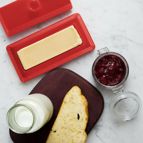 WERTIOO red enameled knife complements the butter dish for stylish serving.