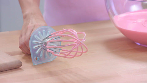 Close-up of WHISK WIPER lifting whisk loops to reduce mess