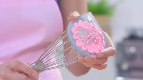 WHISK WIPER in use over a bowl catching drips for cleaner counters