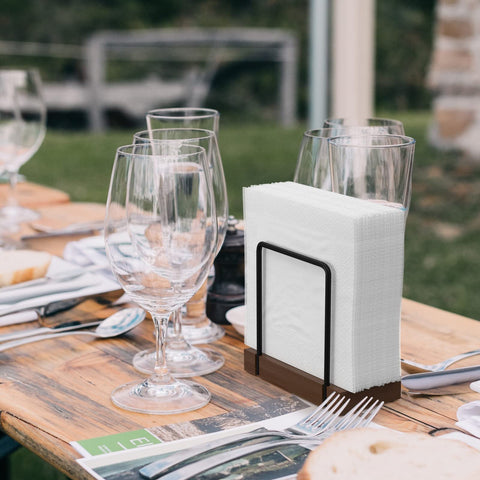 Wican napkin holder for picnics and camping stays organized outdoors.