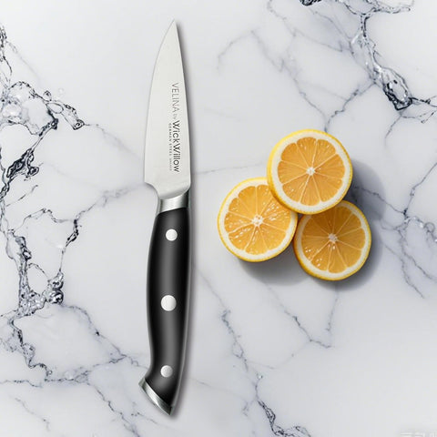 WICKWILLOW paring knife full tang close-up showing balanced grip.