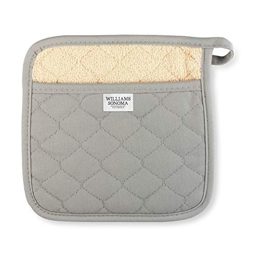 Williams-Sonoma striped potholder in drizzle grey protecting hands while lifting hot cookware