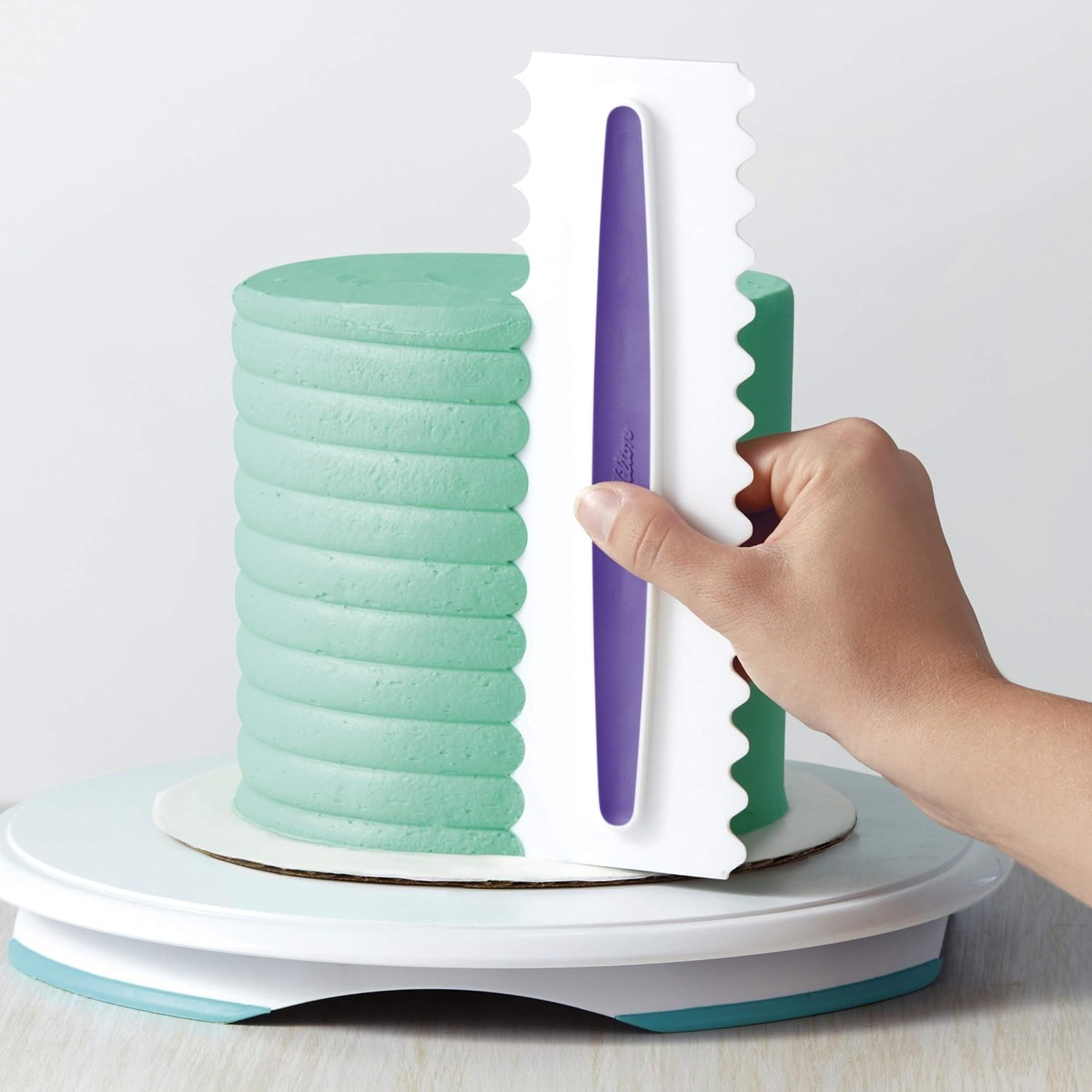 Wilton Comb Icing Smoother durable plastic construction delivers bakery-style frosting textures.