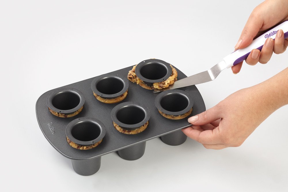Wilton cookie shot glass pan inserts ensure clean release and consistent shape.