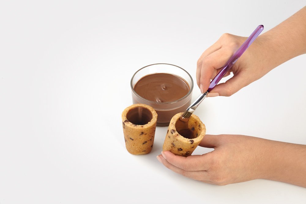 Wilton cups cool before Candy Melts coating and tasty fillings.