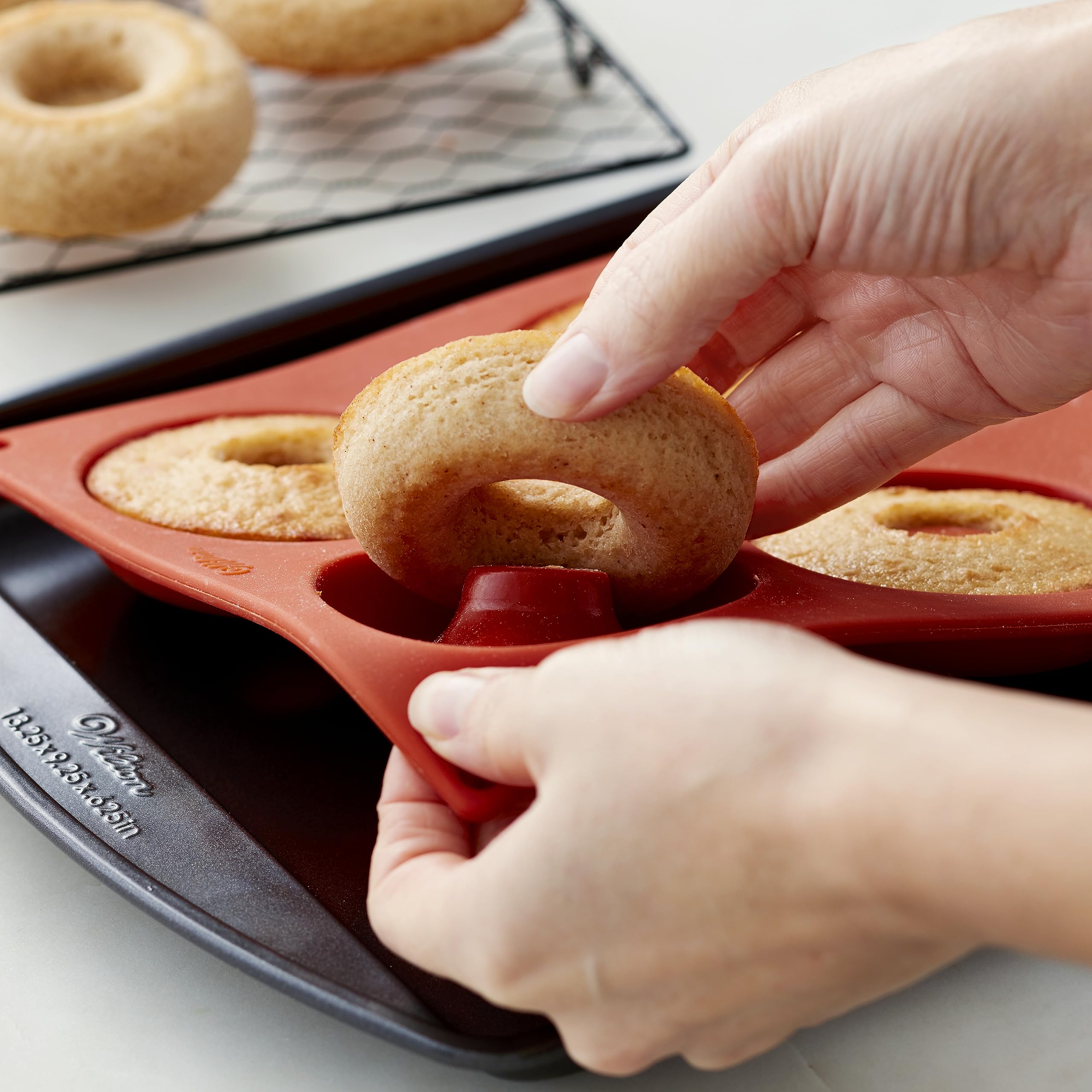 Wilton donut pan oven-safe up to 375°F for versatile donut making.