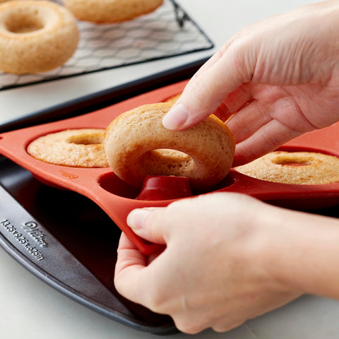 Wilton donut pan oven-safe up to 375°F for versatile donut making.