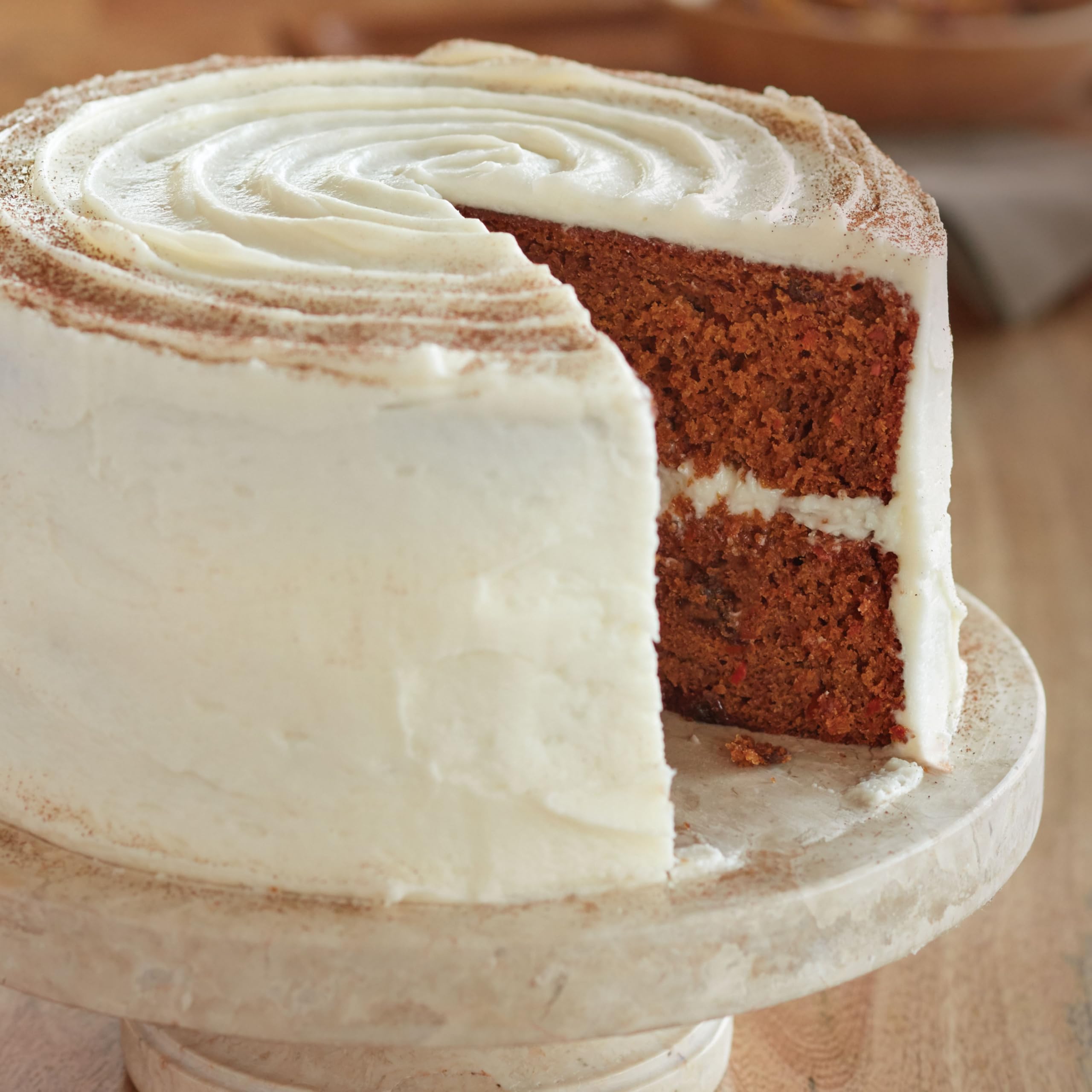Wilton Gold Premium round cake pan in oven up to 450°F for versatile baking.
