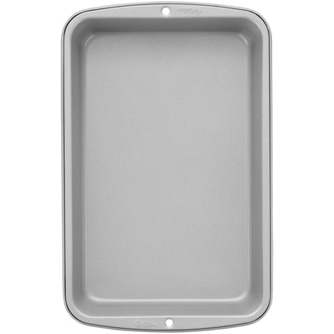 Close-up of durable steel bakeware from Wilton for consistent heat.