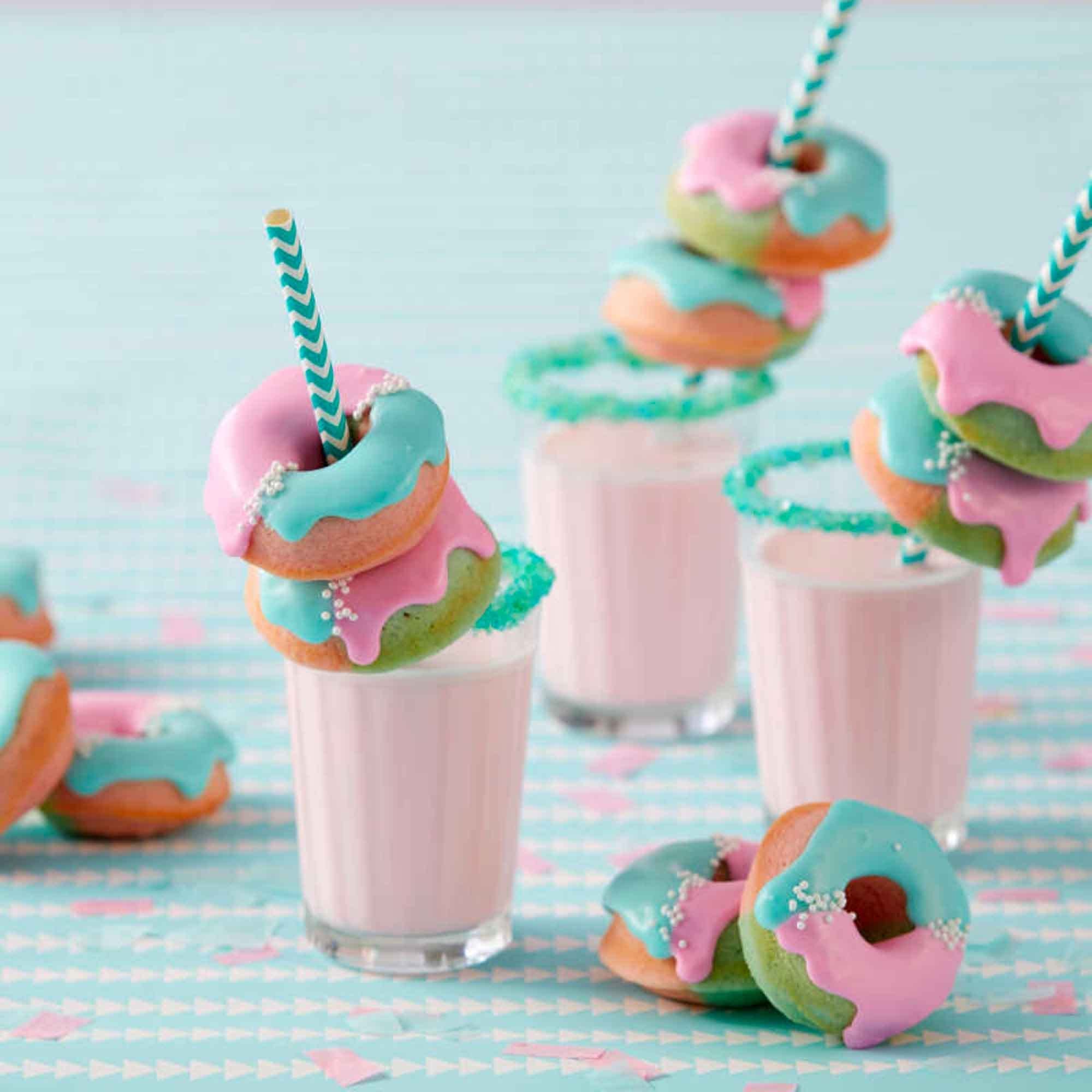 In-use view of the Wilton Mini Donut Pan shows batter filling and shaping donuts.