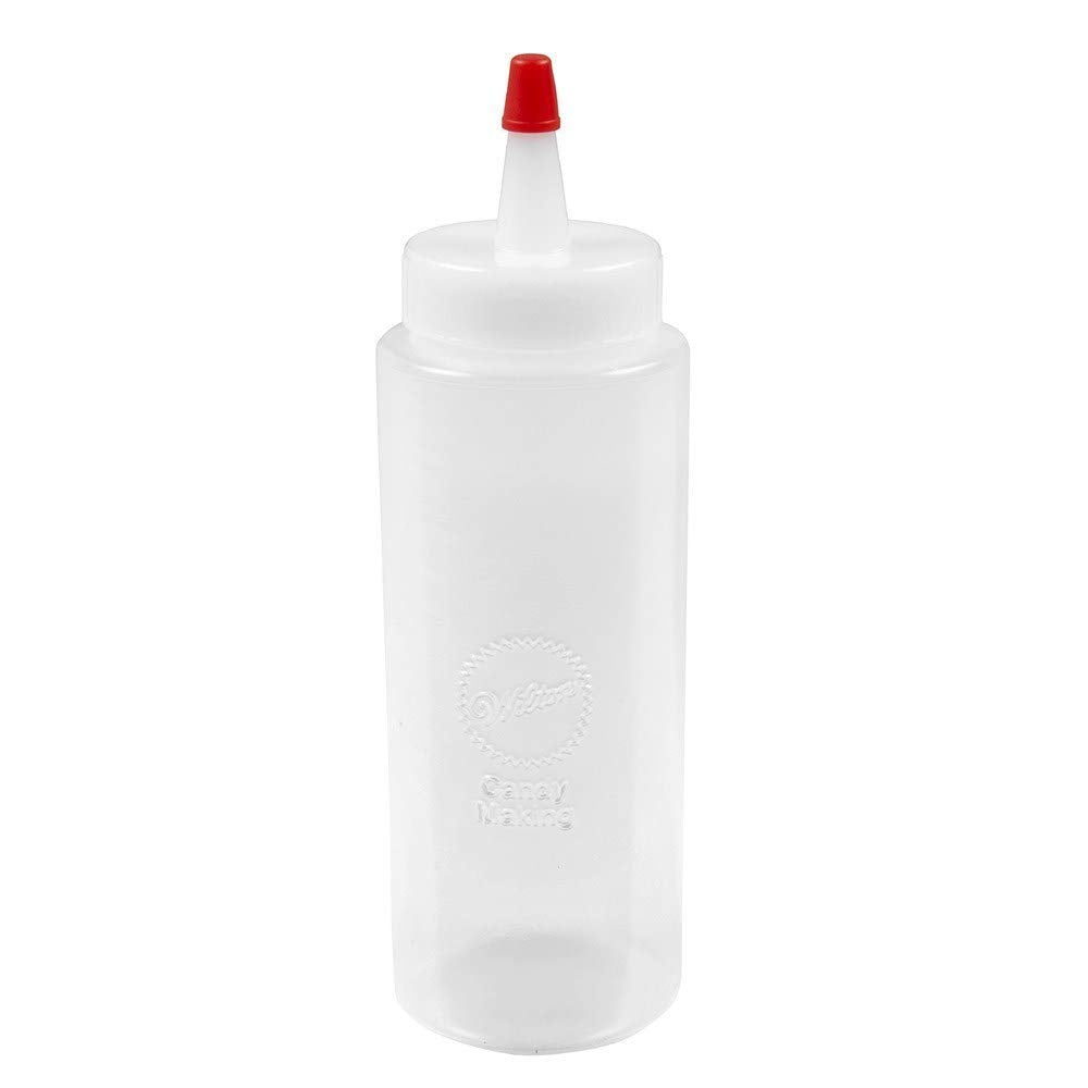 Wilton regular melting decorating squeeze bottle in use, perfect for precise candy lines and quick melting.