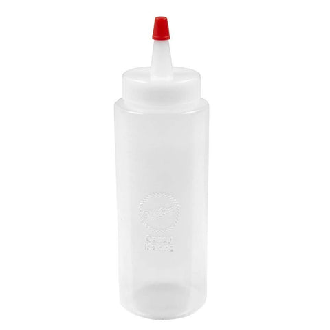 Wilton regular melting decorating squeeze bottle in use, perfect for precise candy lines and quick melting.