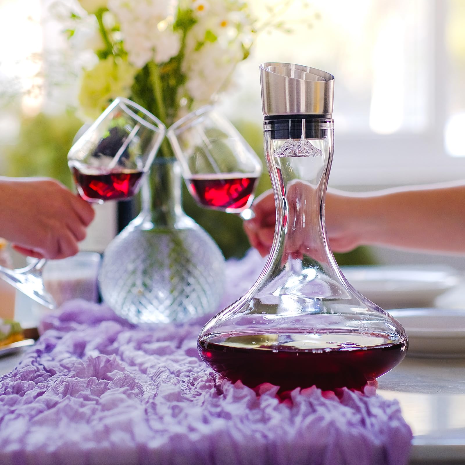 Wlasss crystal decanter with stainless pour lid for clean, drip-free pouring.