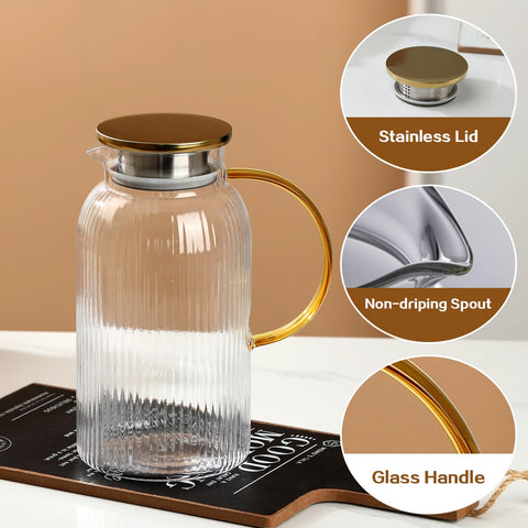 Wlasss pitcher handle and lid with dual openings for pouring.